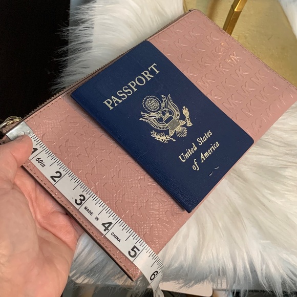 Authentic soft pink patent leather large wristlet clutch by Michael Kors